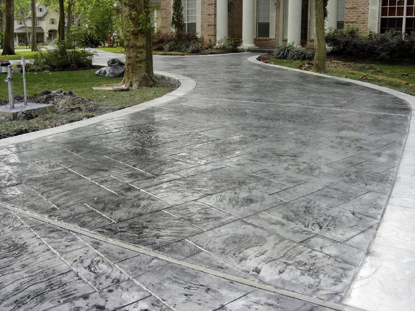 Decorative stamped concrete drive and pool decking