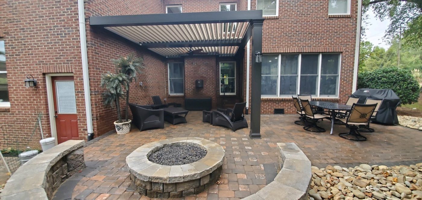 Covered patio with fire pit in Davidson