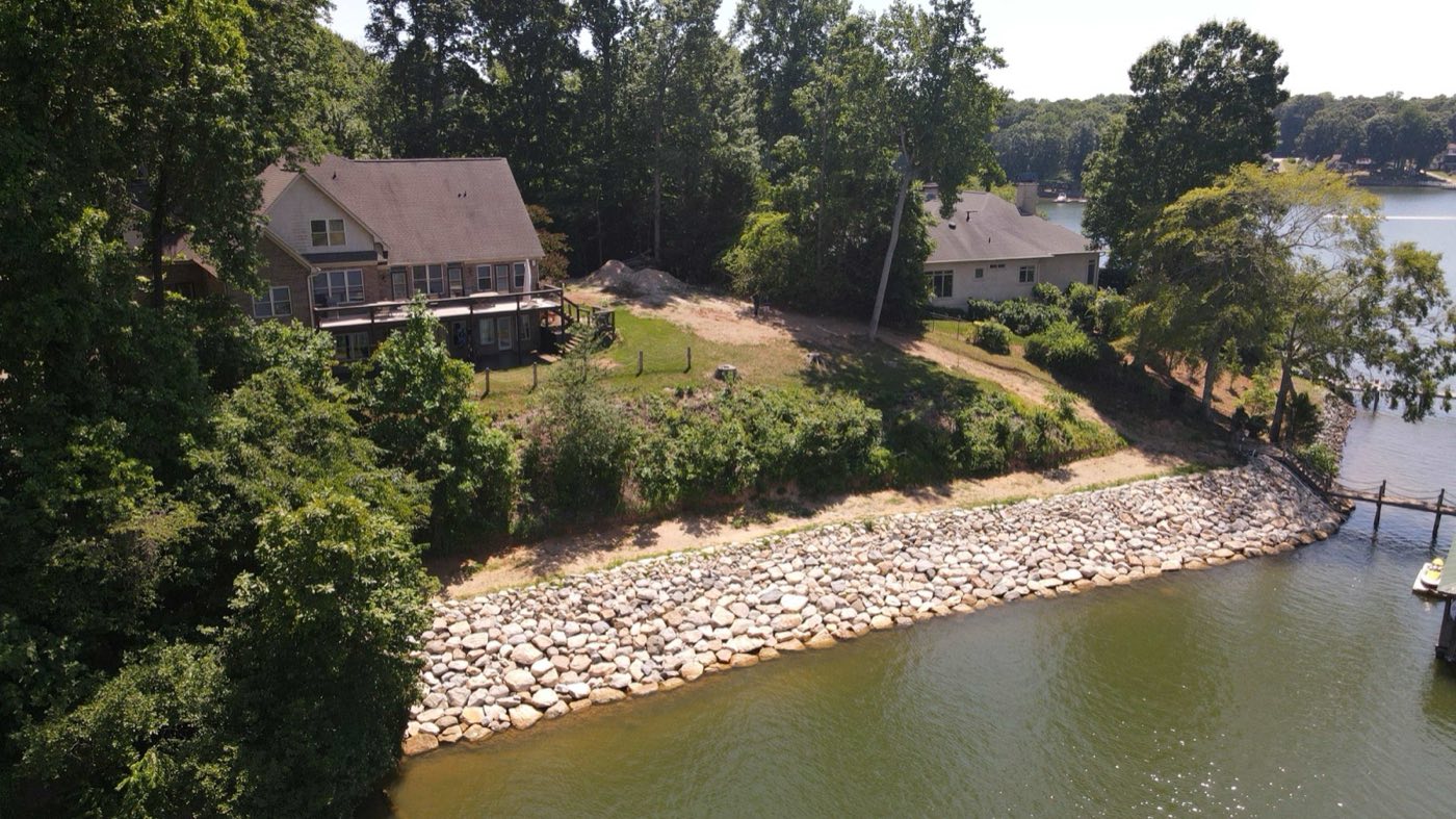 Aerial of a newly armoured riprap shoreline protecting a Mooresville lakefront lot