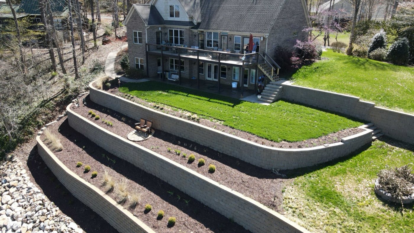 Three-tier lakefront retaining wall with planted terraces in Mooresville