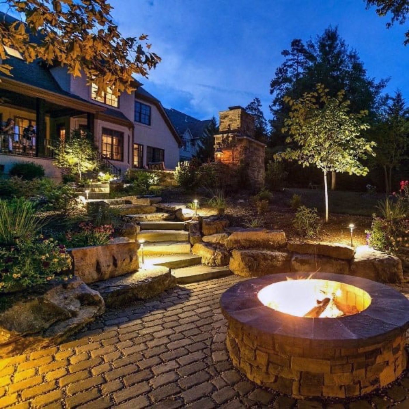 Natural stone patio with seating area built by Carolina Custom Stone and Hardscape