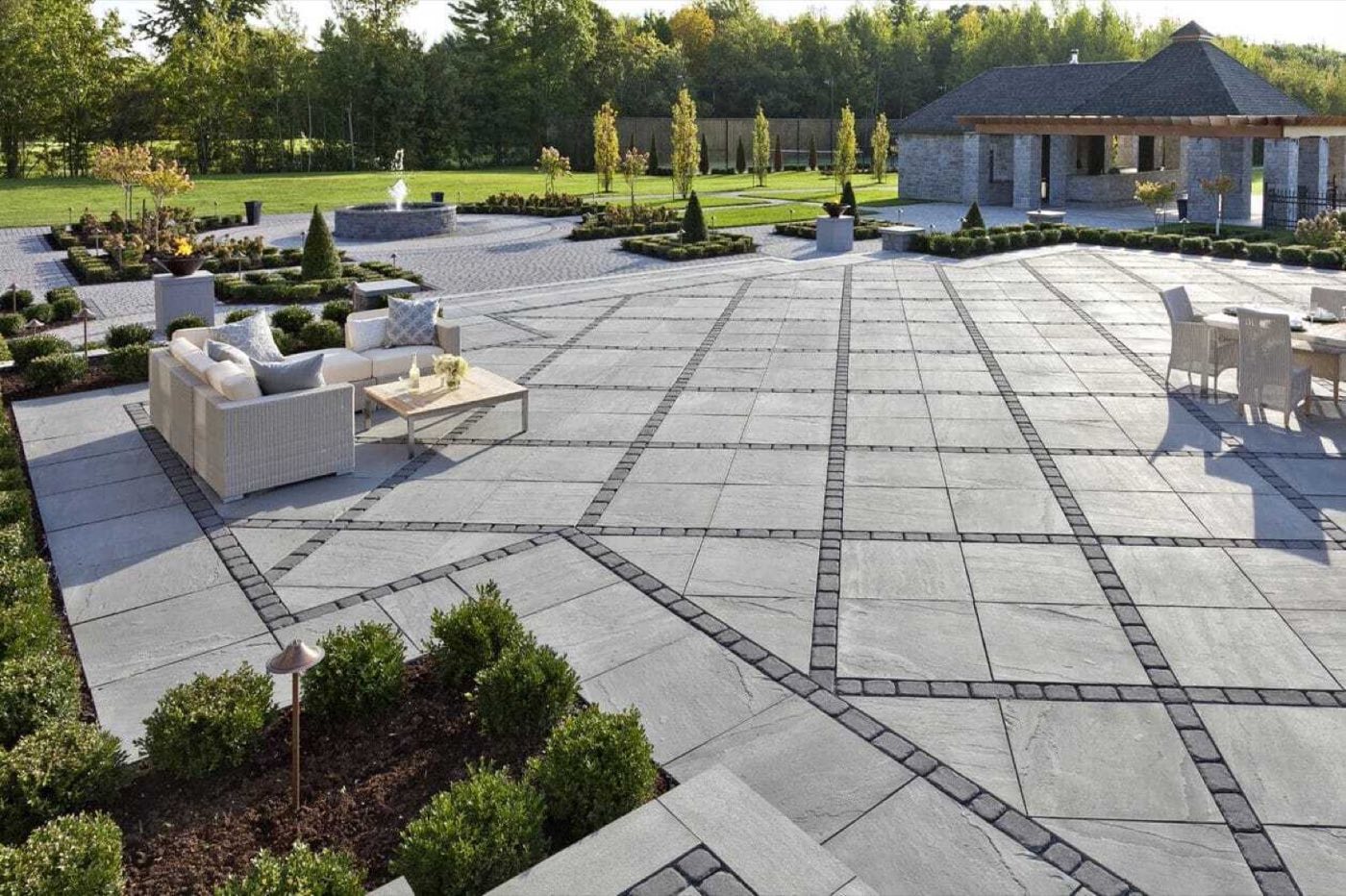 Paver patio installation showing base preparation and laid pavers