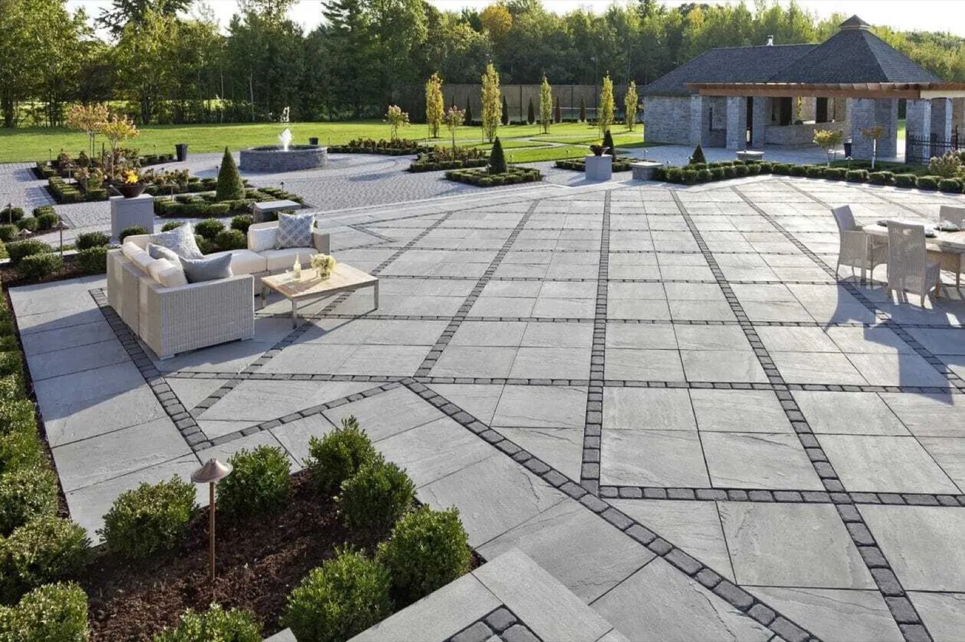 Paver patio installation showing base preparation and laid pavers